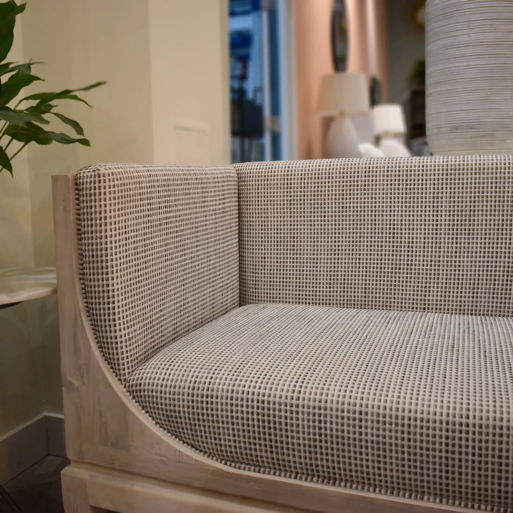 Raphael sofa front view with curved silhouette and architectural pastel design