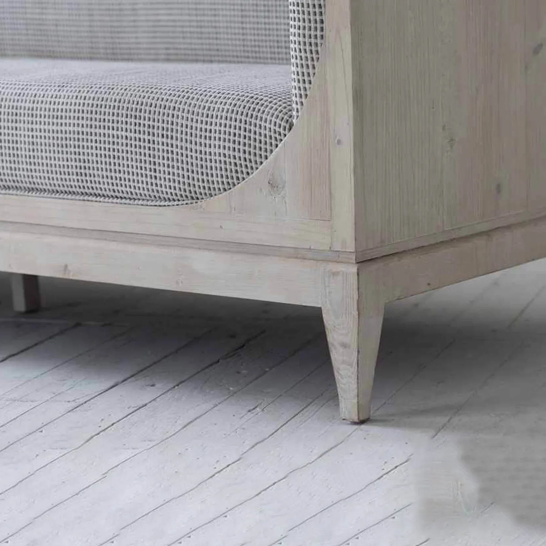 Raphael sofa front view with curved silhouette and architectural pastel design