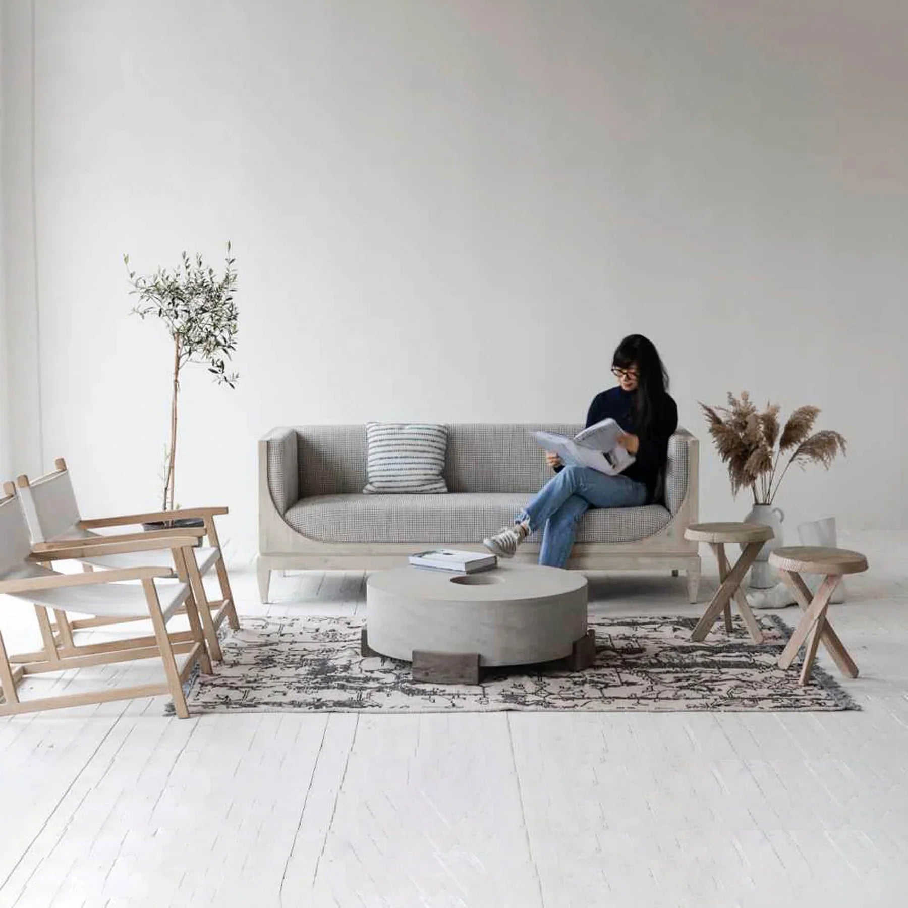 Raphael sofa front view with curved silhouette and architectural pastel design