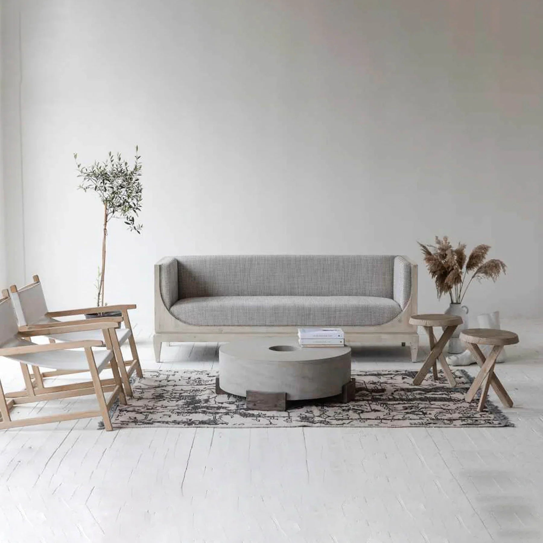Raphael sofa front view with curved silhouette and architectural pastel design
