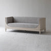 Three-quarter view of Raphael sofa showcasing curved arms and elegant structure