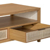 Close-up view of one drawer pulled open to show the storage interior and the contrast between the wood frame and woven rattan face