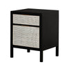 Three-quarter perspective view of the Ebony Rattan filing cabinet featuring a matte black frame and two drawers with natural woven rattan panels