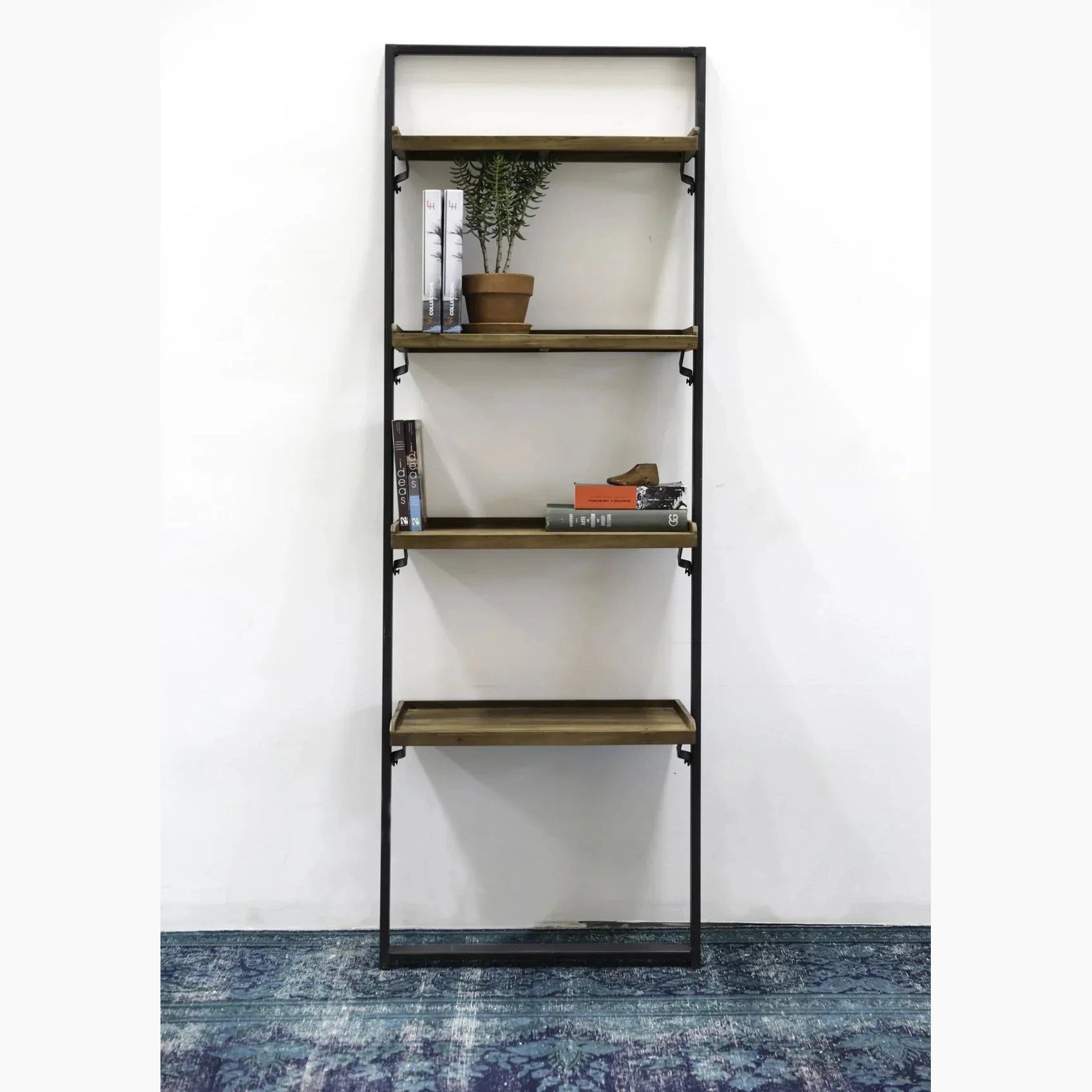 Straight-on front view of the D-Bodhi wall rack featuring a slim black metal frame and four reclaimed wood tray shelves
