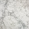 Close-up surface shot focusing on the seamless material match of the rectangular faux marble extension leaf