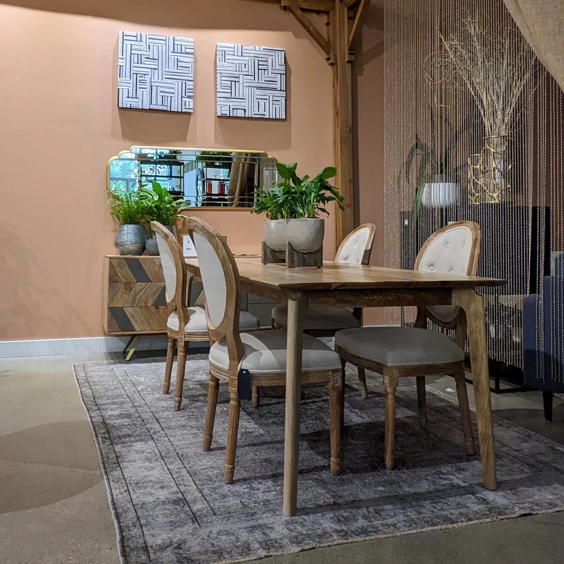 Front view of the Kenzo dining table in a light natural mango wood finish featuring a minimalist rectangular top and rounded tapered legs