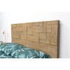Close-up perspective focusing on the unique hand-assembled wood patchwork pattern of the headboard