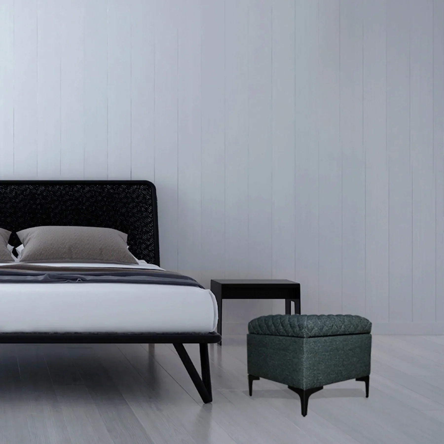 Front three-quarter view of the Reece square storage ottoman in black fabric featuring a diamond-quilted tufted lid