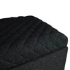 Detailed close-up of the plush diamond-quilted upholstery and finished corner of the Reece ottoman lid