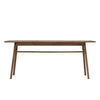 Front view of the Remix dining table in a rich walnut-toned acacia wood featuring a minimalist rectangular top and flared tapered legs