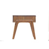 Side profile view emphasizing the clean lines of the drawer unit and the elegant angle of the tapered wooden legs
