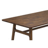Close-up perspective shot focusing on the seamless connection between the table apron and the flared wood legs