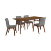 Perspective shot of the dining table configured with six modern grey upholstered chairs for a family seating arrangement