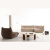 Lifestyle arrangement showing three Rigo chairs in different colors placed together in a minimalist room.
