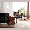 Lifestyle shot of the Rio armchair styled in a bright transition space near large glass doors