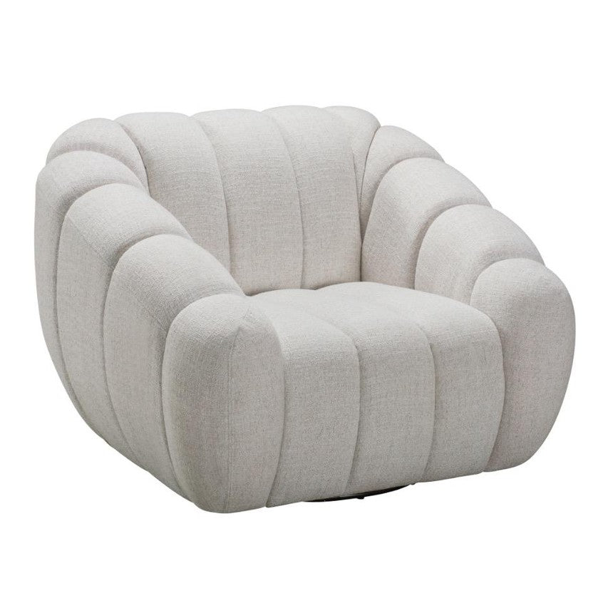 Three-quarter view of the Riro Swivel Chair highlighting its deep vertical tufting and sculptural shape.