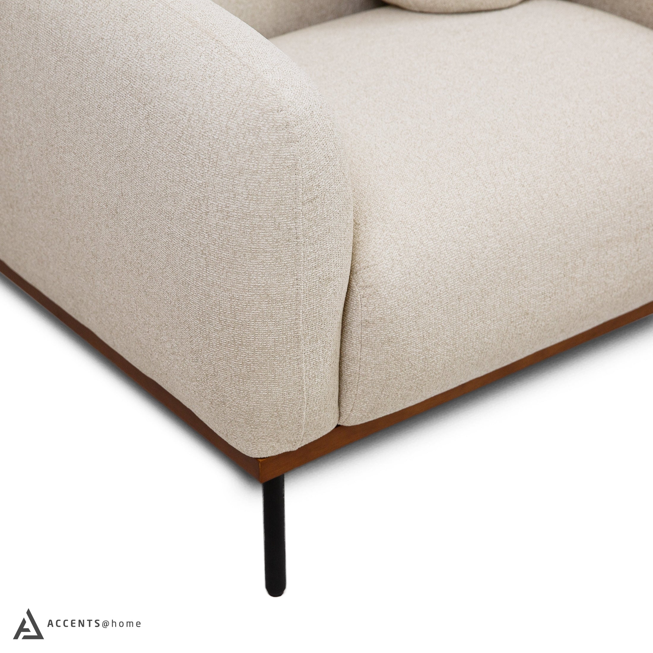 Detail of wooden base and metal legs on Rodeo accent chair