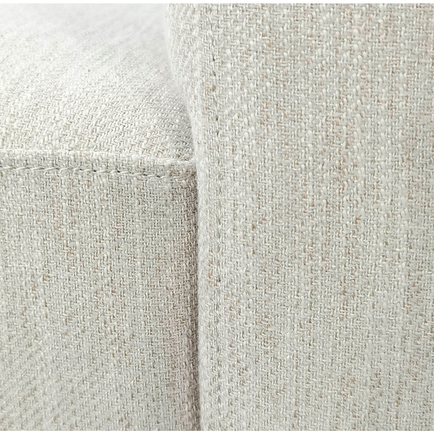 Close-up detail of the durable textured fabric and the high-quality corner stitching on the Romer chair