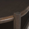 Close-up shot focusing on the high-quality joinery where the rounded vertical leg meets the curved tabletop edge