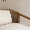 Macro close-up of the high-quality woven cane and the smooth finish of the oak frame