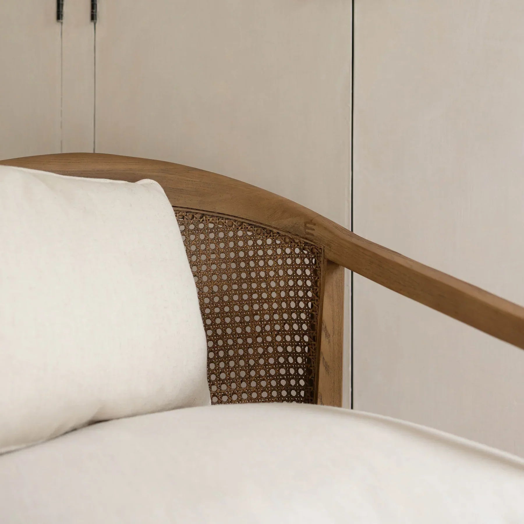 Macro close-up of the high-quality woven cane and the smooth finish of the oak frame