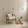 The Rosa chair styled in a minimalist room with neutral tones and organic decor