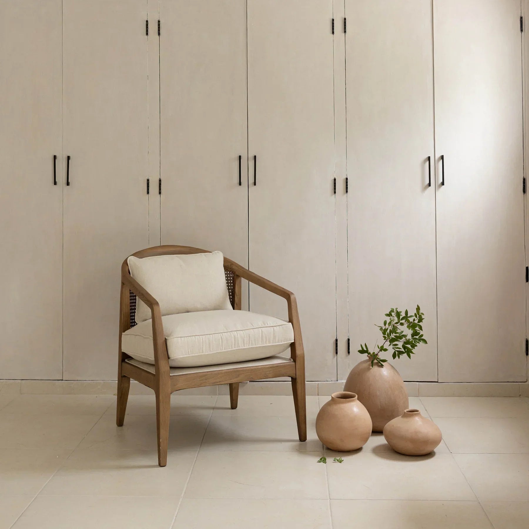The Rosa chair styled in a minimalist room with neutral tones and organic decor