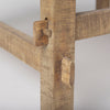 Detailed view of the handcrafted mortise and tenon joinery on the trestle base legs