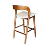 Rear-angle view of the Rotondo stool showcasing the smooth walnut wood grain and joinery