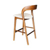 High-angle perspective of the Rotondo counter stool's cushioned cream seat