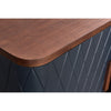 Close-up shot focusing on the smooth rounded corner of the natural wood top and the intricate diamond-quilted texture of the navy blue frame