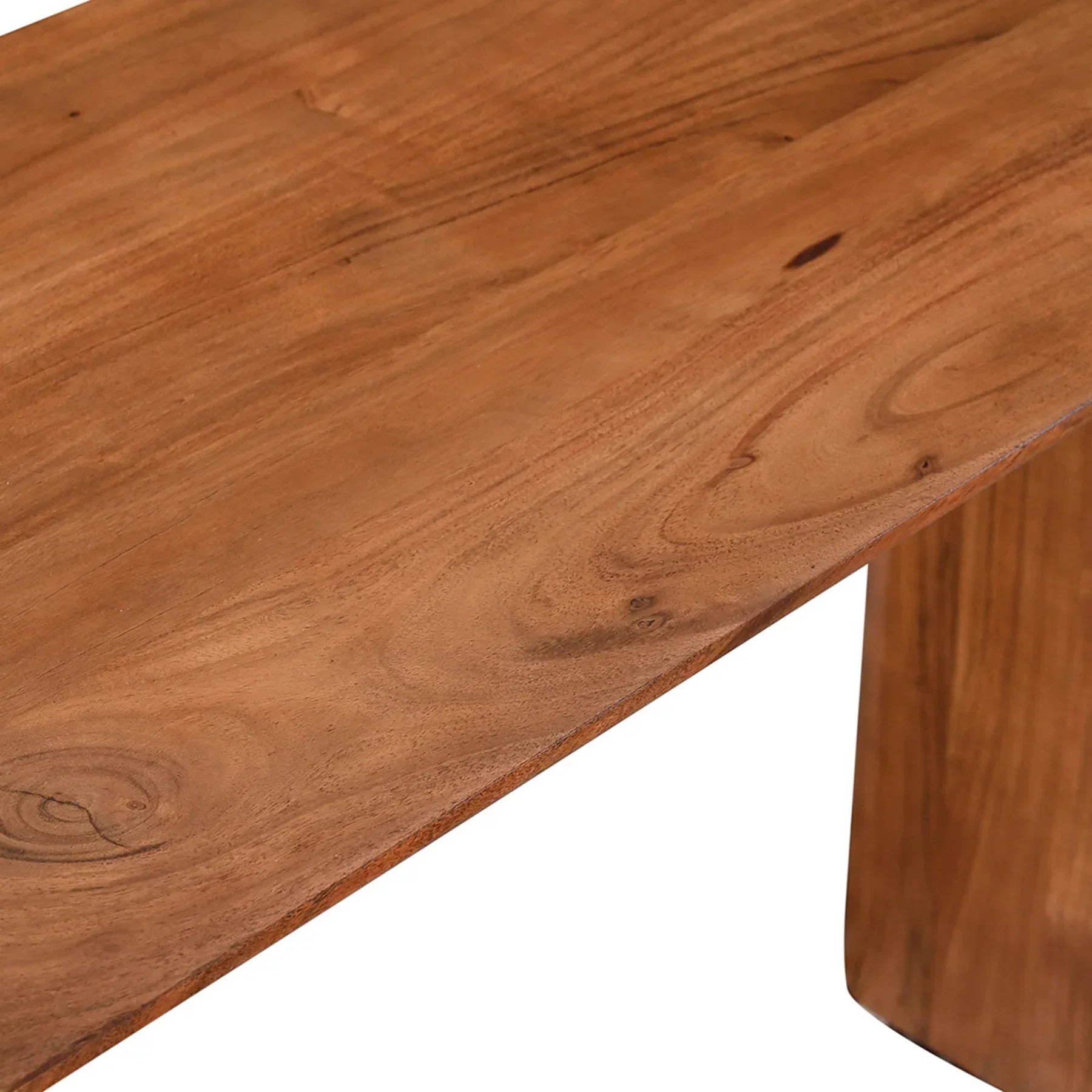 Macro shot focusing on the smooth rounded edge of the tabletop and the fine texture of the wood finish