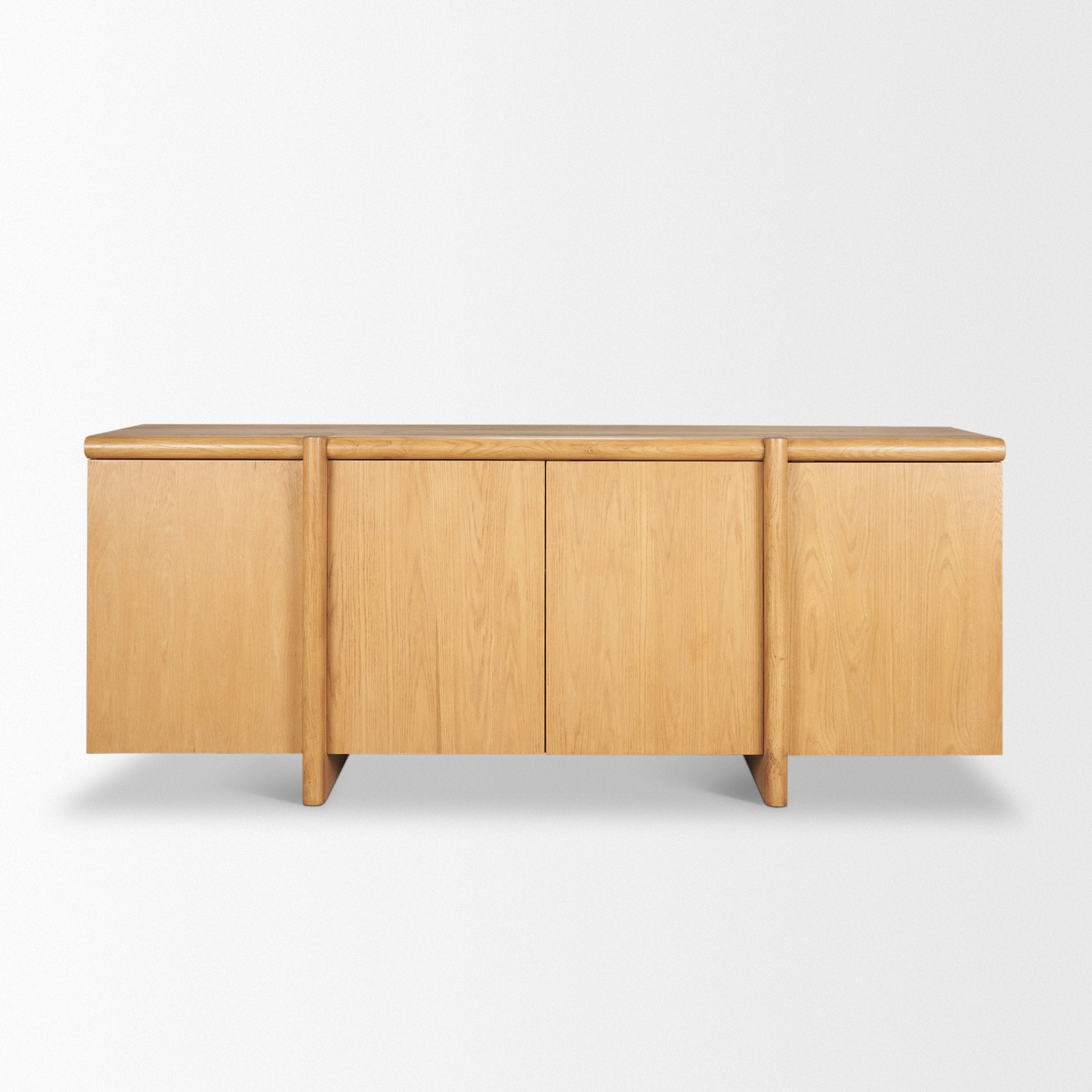 Front view of the Rowan 4-door sideboard in a natural oak finish featuring a clean minimalist silhouette and integrated vertical wood handles