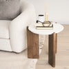 Wide lifestyle view showing the marble and wood table integrated into a bright contemporary living room setting