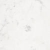 Extreme close-up of the white marble surface highlighting the authentic natural stone patterns and grey veining