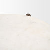 Close-up high-angle shot focusing on the soft grey natural veining and smooth polished finish of the white marble top