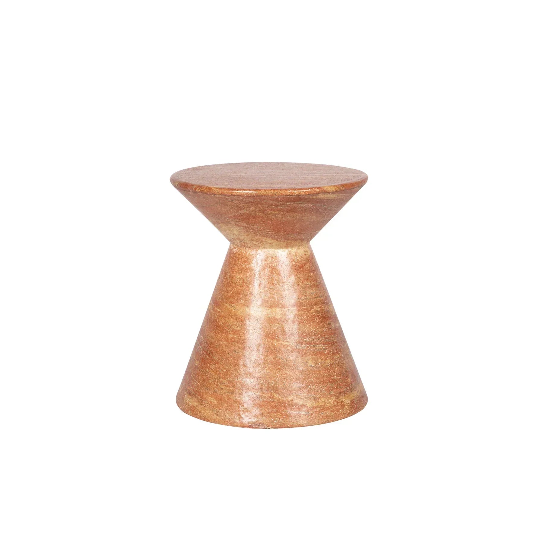 Three-quarter view of the Rumi side table featuring a sculptural hourglass silhouette crafted from natural red travertine stone