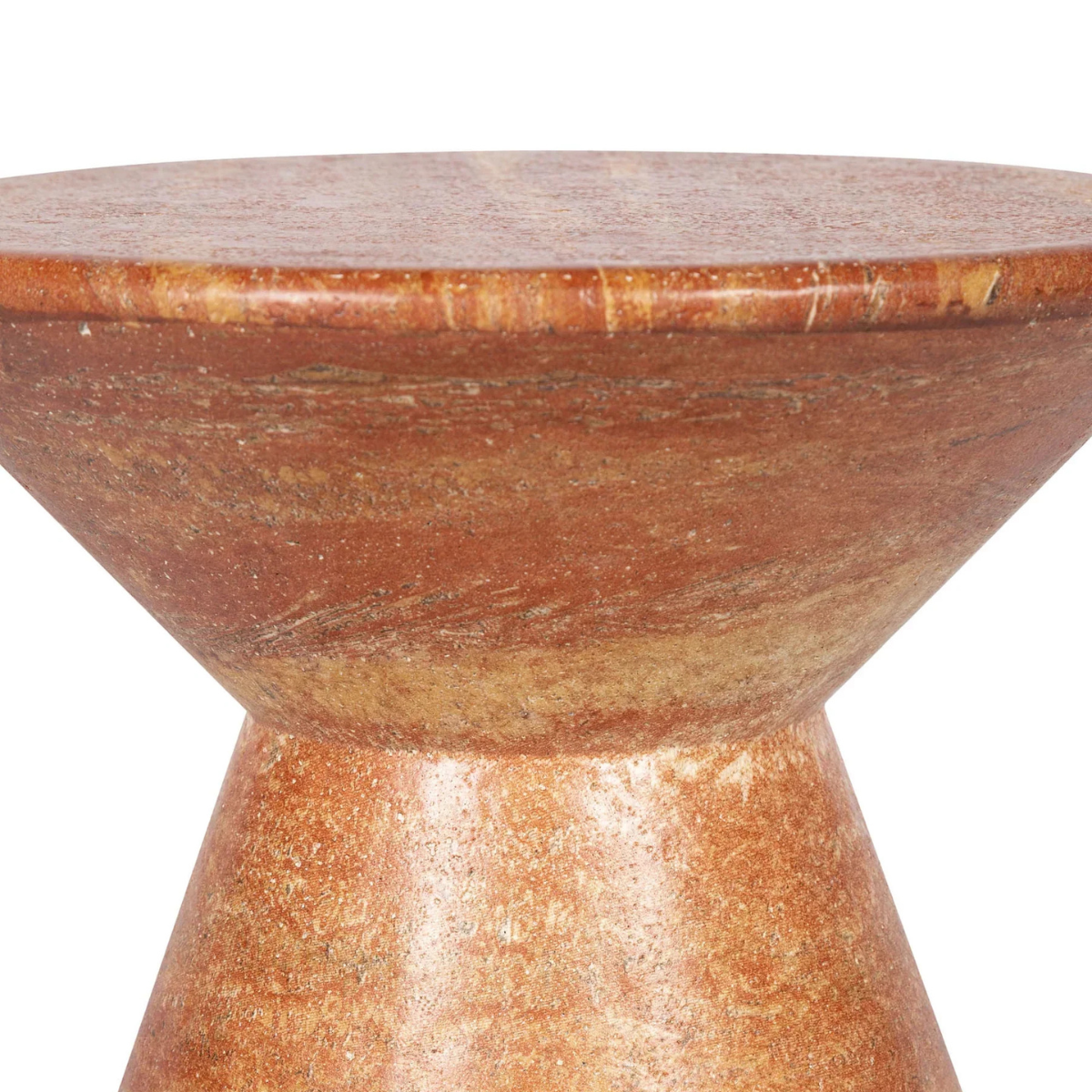 Three-quarter view of the Rumi side table featuring a sculptural hourglass silhouette crafted from natural red travertine stone