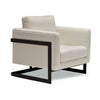 Three-quarter view of the Runa chair highlighting its square-profile black metal frame and plush cushioned seat and backrest