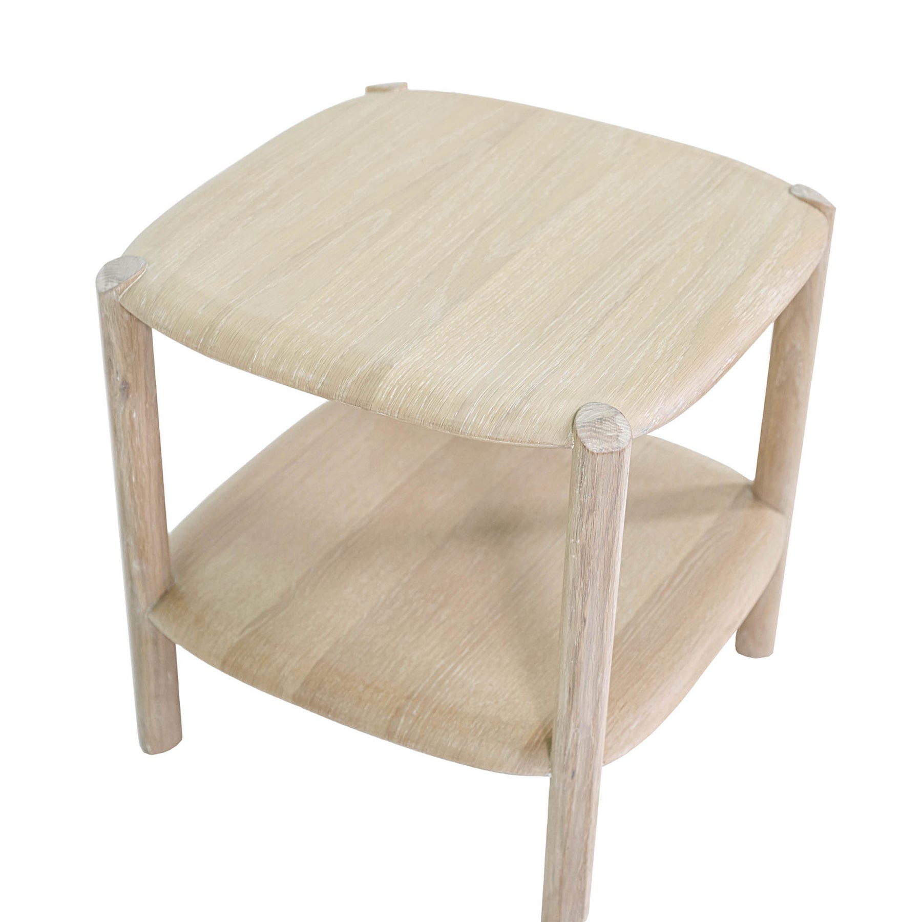 High-angle perspective view emphasizing the rounded corners and seamless joinery of the light oak finish tabletop