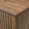 Macro detail shot focusing on the tactile natural wood grain and high-quality finish of the chest's top surface