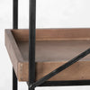 Close-up shot focusing on the recessed tray design of the rustic wood shelves and secure mounting to the black metal uprights