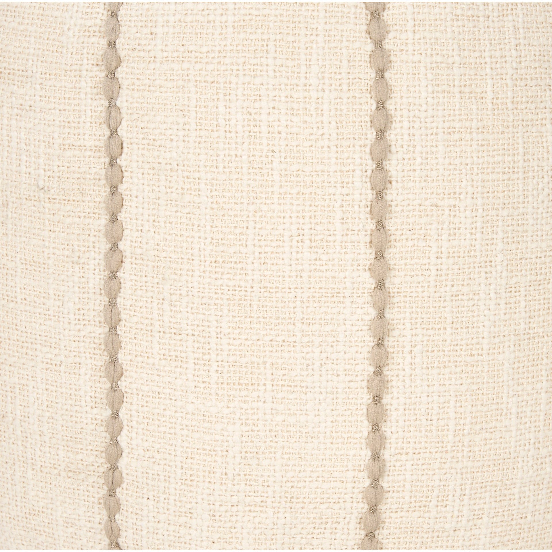 Front view of the Sachi round pouf in beige textured fabric with decorative vertical brown stitching creating a ribbed effect