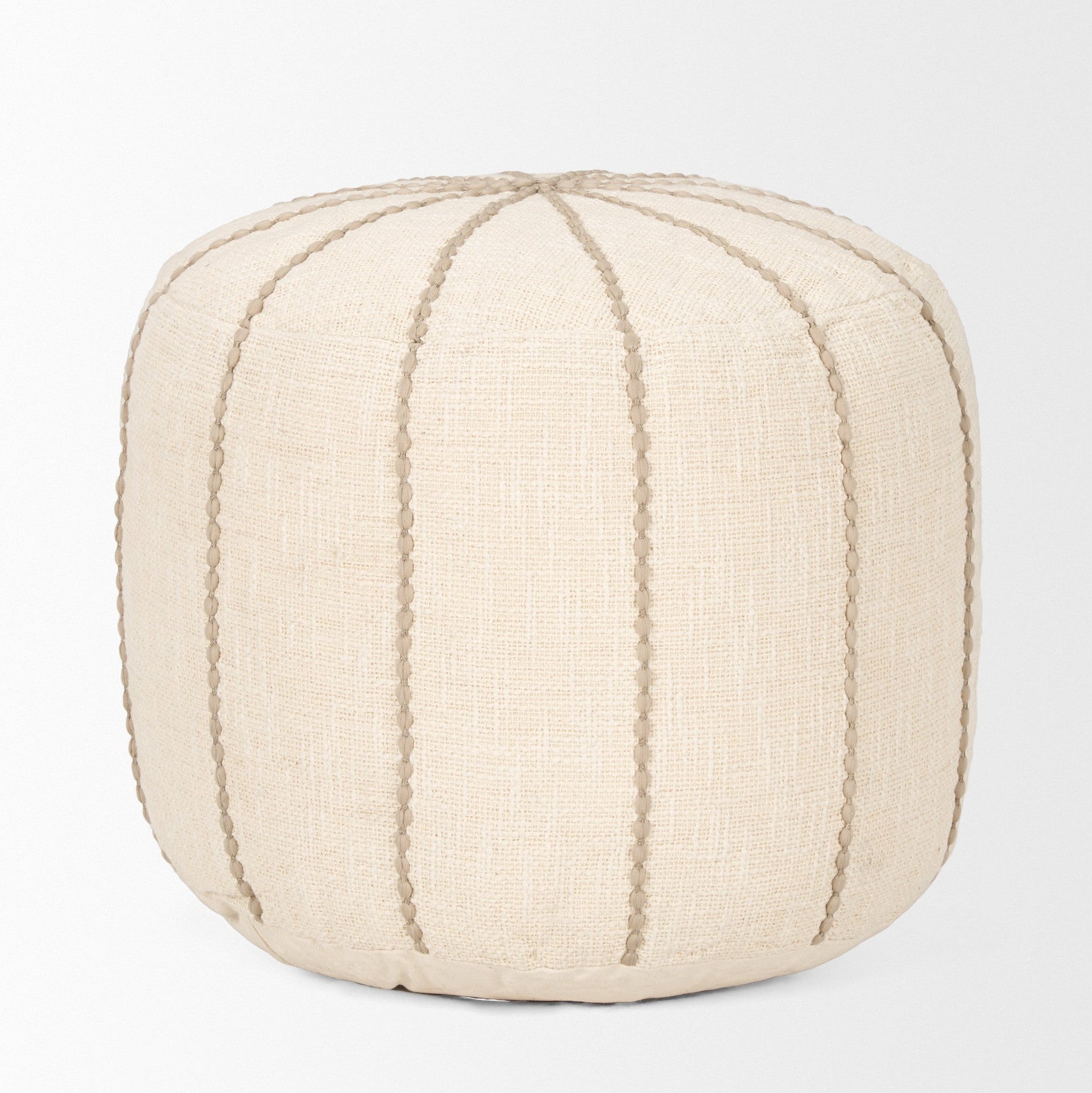 Front view of the Sachi round pouf in beige textured fabric with decorative vertical brown stitching creating a ribbed effect