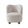 Saga Accent Chair in Oatmeal bouclé fabric featuring a rounded silhouette and wooden ball feet.