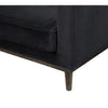 Close-up of the front corner showing the plush velvet texture and precise upholstery stitching