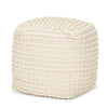 Front three-quarter view of the Sakaye cubic pouf featuring beige fabric with raised cream hand-stitched horizontal patterns