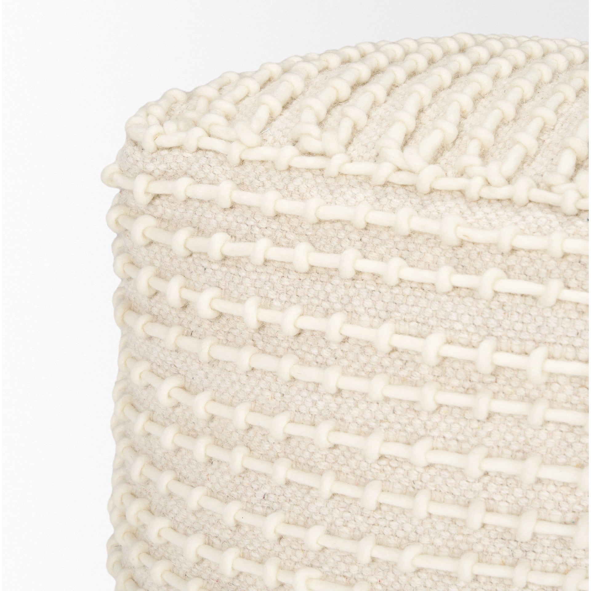 Straight-on front view showing the uniform square silhouette and consistent cream stitching across the beige surface