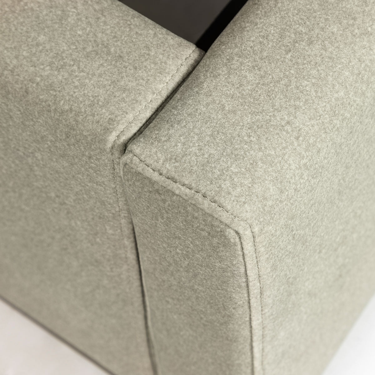 Close-up shot focusing on the high-quality velvet sandstorm fabric texture and the precision-stitched vertical corner seam