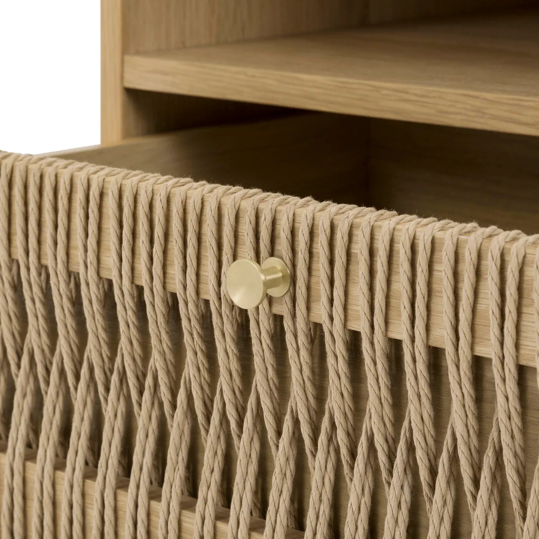 Front view of the Lumina nightstand featuring a light natural ash finish, an open upper shelf, and a unique woven rope drawer front